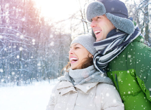 Winter couple. Happy Couple Having Fun Outdoors. Snow. Winter Vacation. Outdoor
