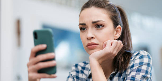 woman texting on phone